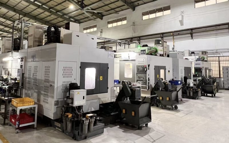 Interior of a manufacturing factory with machinery and equipment, illustrating climate risk factors in industrial operations