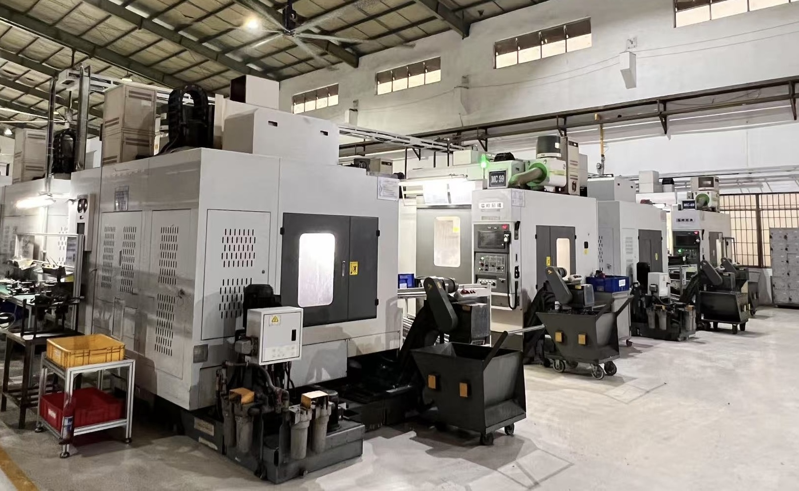 Interior of a manufacturing factory with machinery and equipment, illustrating climate risk factors in industrial operations