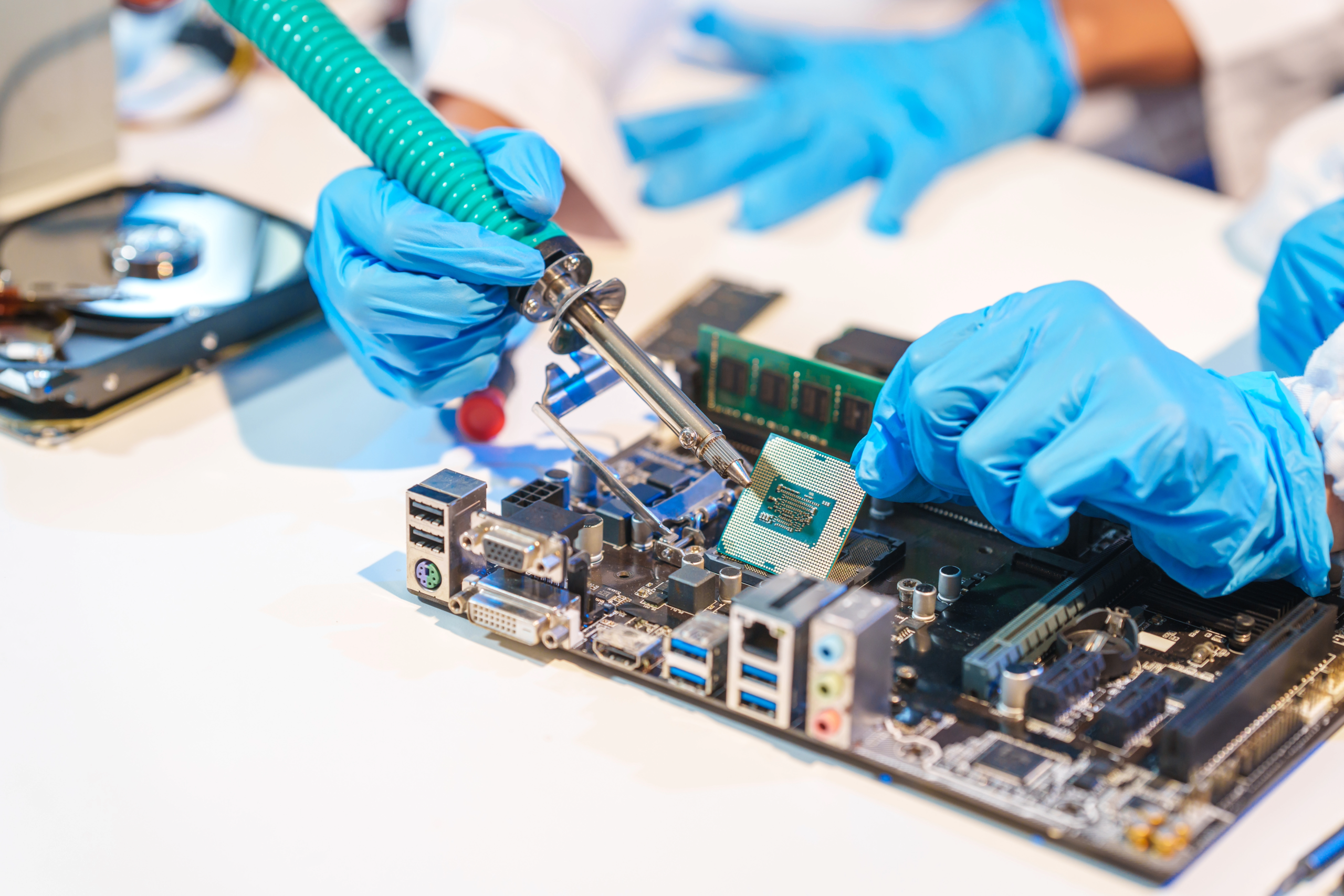 Factory working working on a PCB for smart home IoT Products