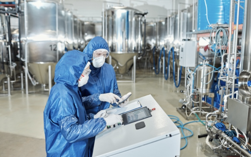 Factory workers following guidelines and safety regulations that are required for certain certifications