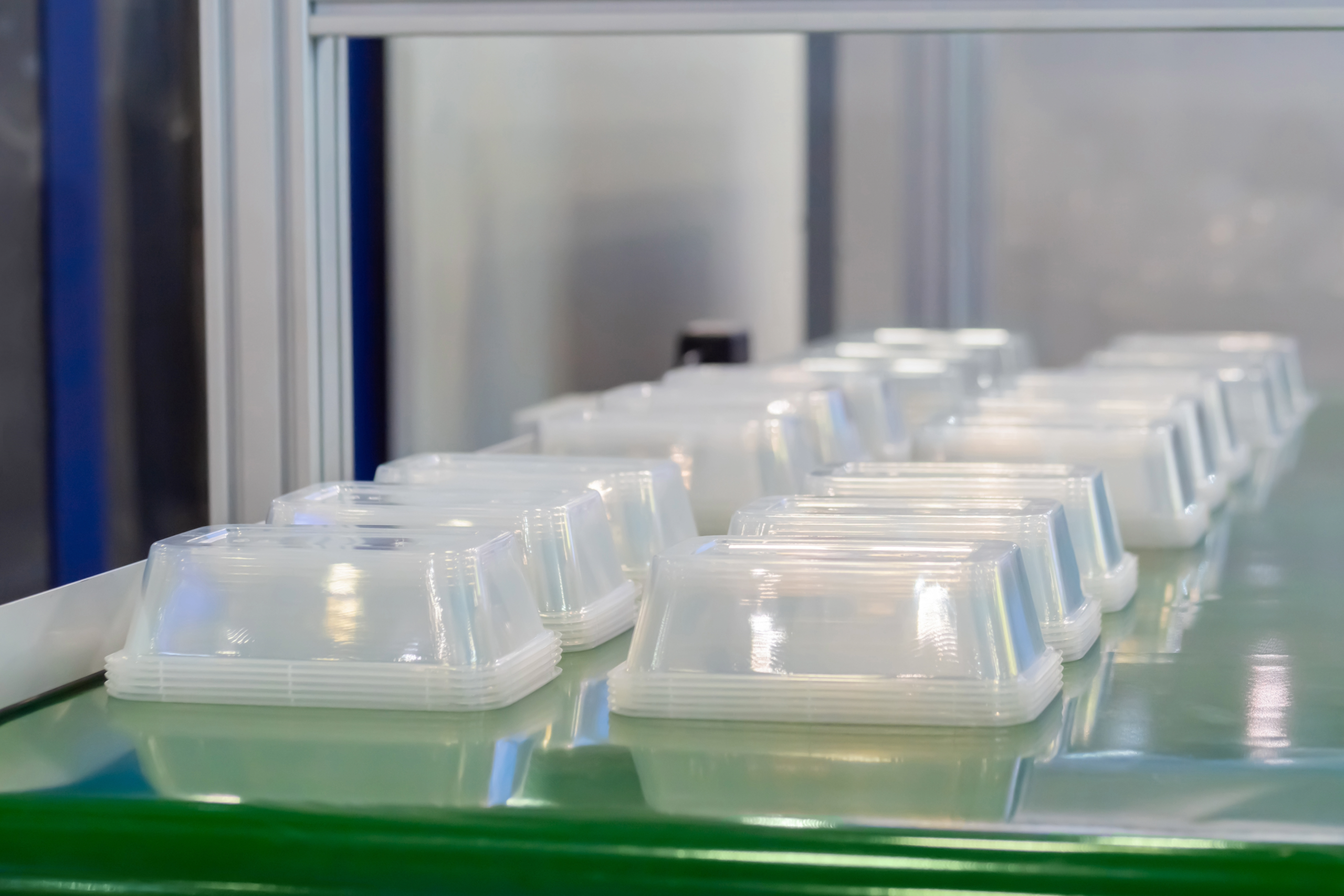 Molded food containers for automated packaging lines