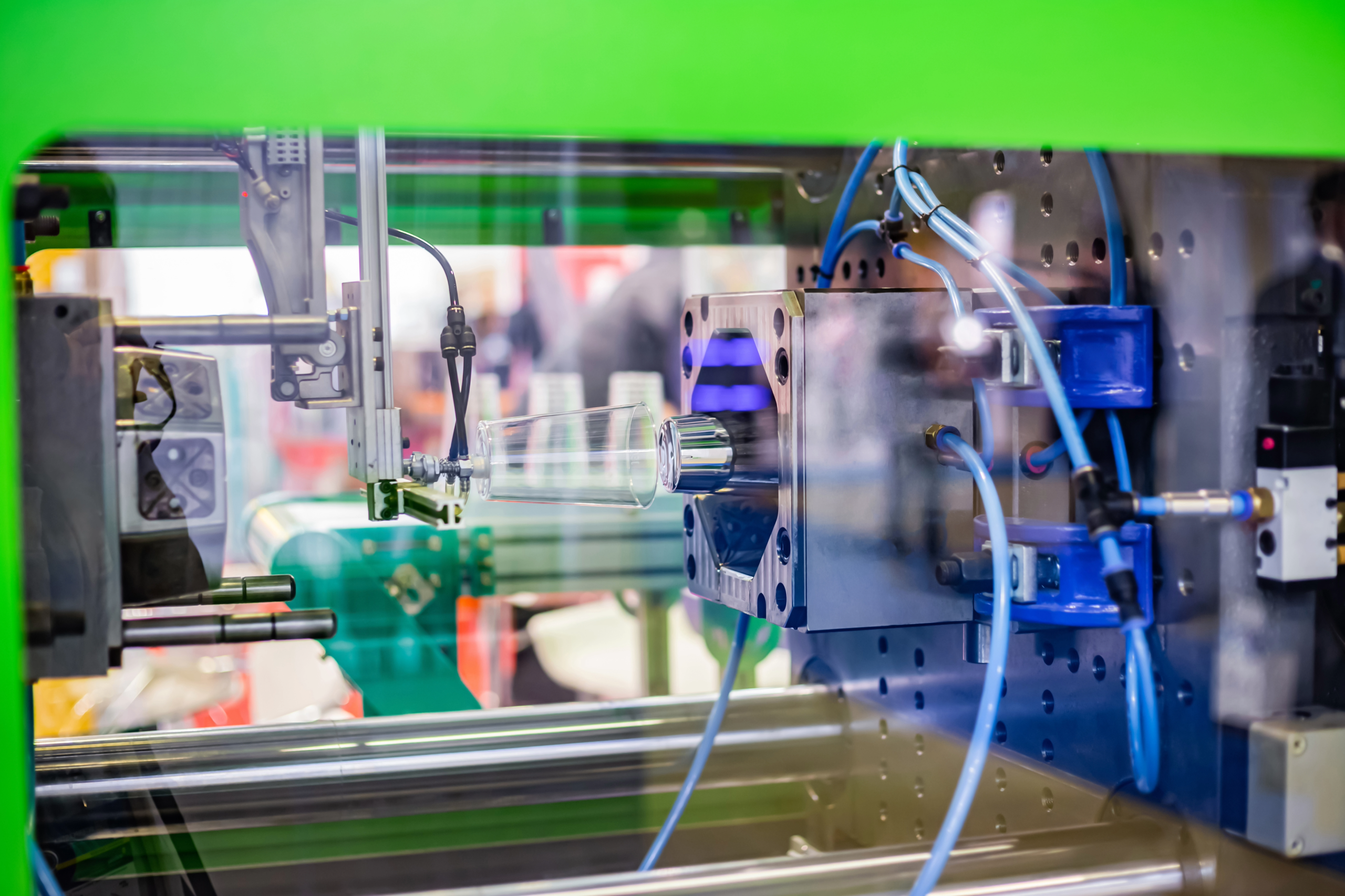 Photo of plastic injection molding, which uses thermoplastics