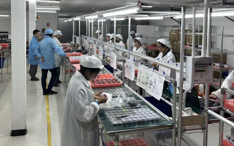 Factory workers at assembly line
