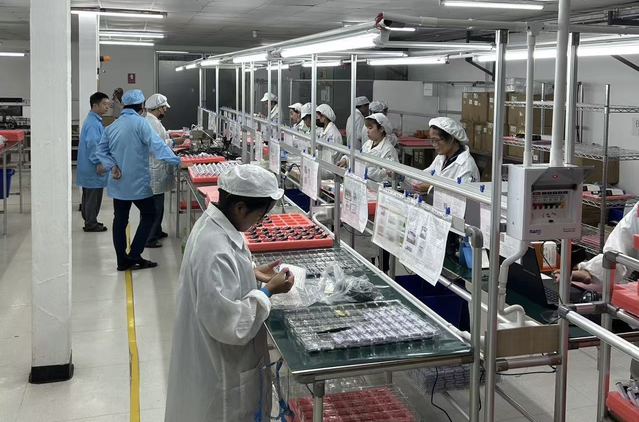 Factory workers at assembly line