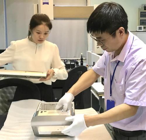 Sue and Henry working on a final critical dimensions measurement at E-BI's metrology lab